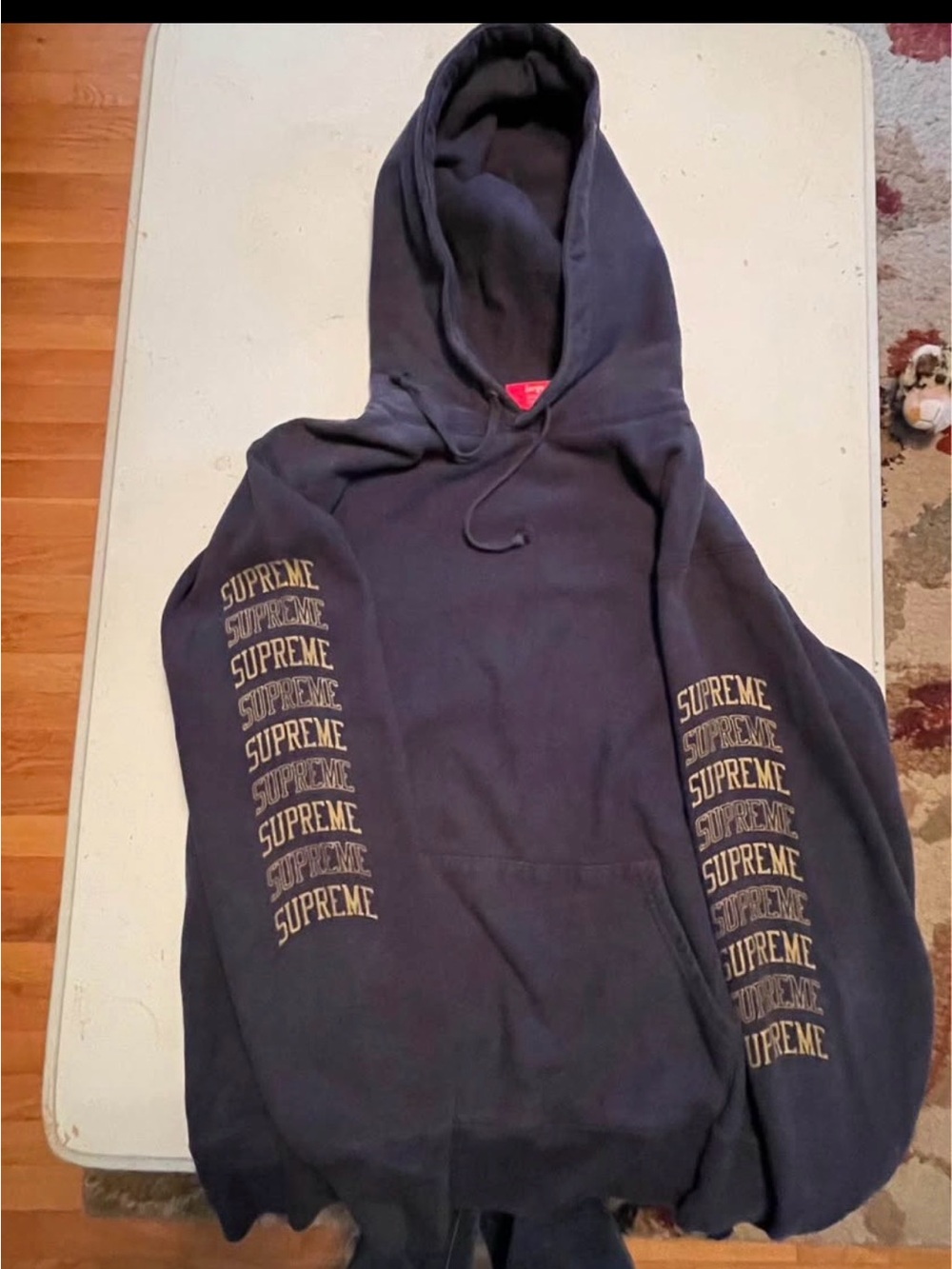 Supreme Navy Hoodie with Gold Sleeve Logos